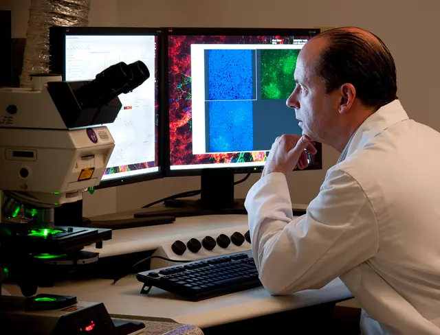 A scientist reviewing imaging results on screen
